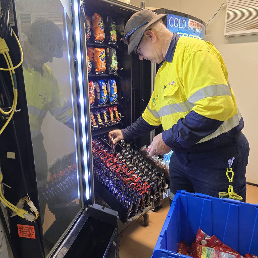 Crib room vending machine being stocked during service run