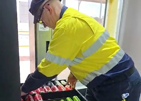 A1 Vending team restocking mine site vending machines with snacks and cold drinks for crews working long shifts