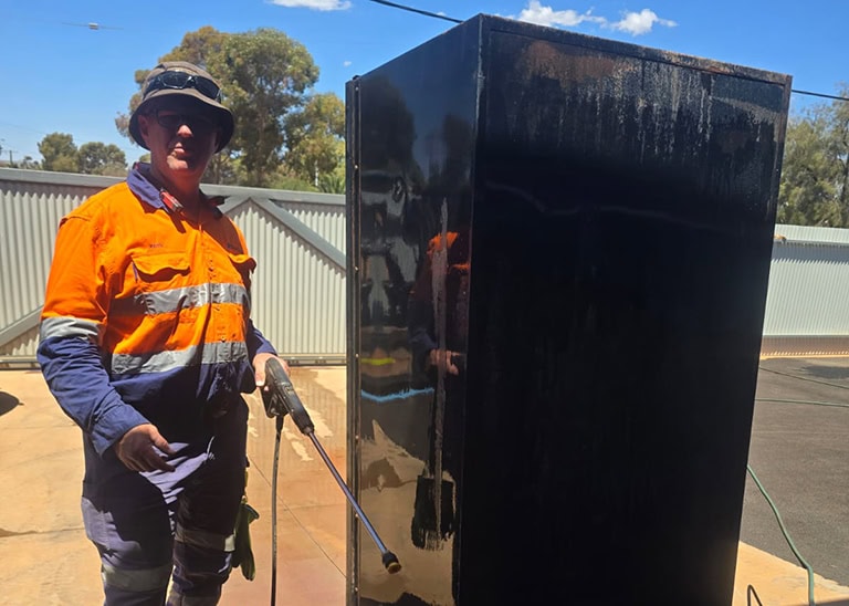 A1 Vending technician completing on-site vending machine repairs WA mine sites rely on — open 24 hours for fault reporting